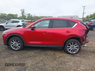 2020 Mazda CX-5 Grand Touring with VIN JM3KFBDM7L1731837, listed as a IAAI auction lot 42160795 with 63,826 mi miles and . Bid and sale history available at DreamBid. Image 15.