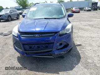 2016 Ford Escape SE z VIN 1FMCU9GX0GUA76647, wystawiony jako IAAI lot #42314233 z przebiegiem 86 010 mil mil oraz . Historia ofert i sprzedaży dostępna na DreamBid. Obrazek 6.