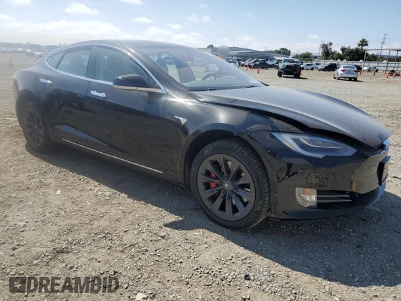 2019 Tesla Model S 100D with VIN 5YJSA1E42KF331240, listed as a Copart auction lot 54713975 with 43,940 mi miles and Salvage title. Bid and sale history available at DreamBid. Image 4.