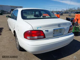 1998 Mazda 626 DX with VIN 1YVGF22CXW5702980, listed as a IAAI auction lot 41778063 with 104,672 mi miles. Bid and sale history available at carsss.com. Image 3.