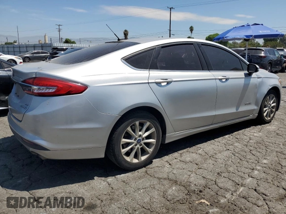 2017 Ford Fusion Hybrid SE z VIN 3FA6P0LU9HR306927, wystawiony jako Copart lot #63943395 z przebiegiem 157 851 mil mil oraz Czysty tytuł • Clean title. Historia ofert i sprzedaży dostępna na DreamBid. Obrazek 3.
