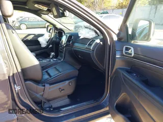 2021 Jeep Grand Cherokee 80th Anniversary z VIN 1C4RJFBG5MC737412, wystawiony jako IAAI lot #41753550 z przebiegiem 54 921 mil mil oraz . Historia ofert i sprzedaży dostępna na DreamBid. Obrazek 5.