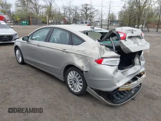 2015 Ford Fusion SE Hybrid with VIN 3FA6P0LU6FR210606, listed as a IAAI auction lot 42070466 with 123,043 mi miles and . Bid and sale history available at DreamBid. Image 3.