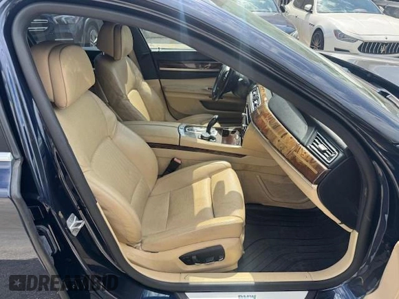 2015 BMW 7 Series 750i xDrive with VIN WBAYB6C5XFD965910, listed as a Copart auction lot 55407895 with 173,486 mi miles and Salvage Title. Bid and sale history available at carsss.com. Image 7.
