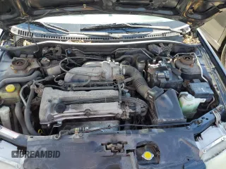 1997 Mazda Protege DX z VIN JM1BC1412V0157268, wystawiony jako Copart lot #61380564 z przebiegiem 85 356 mil mil oraz Szkoda całkowita • Salvage title. Historia ofert i sprzedaży dostępna na DreamBid. Obrazek 11.