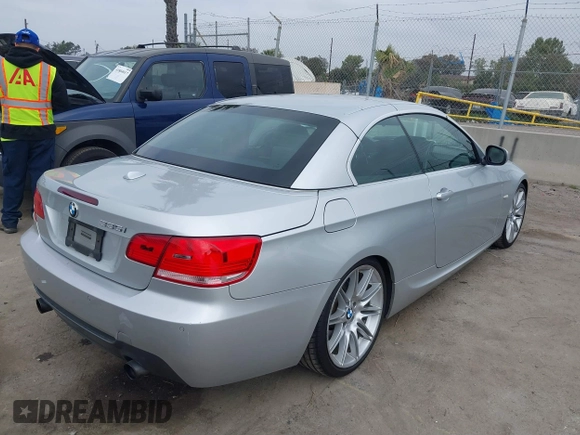 2010 BMW 3 Series 335i with VIN WBAWL7C53AP474127, listed as a IAAI auction lot 41871518 with 111,136 mi miles. Bid and sale history available at carsss.com. Image 4.