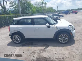 2014 MINI Countryman z VIN WMWZB3C50EWR37412, wystawiony jako IAAI lot #42330526 z przebiegiem 139 310 mil mil oraz . Historia ofert i sprzedaży dostępna na DreamBid. Obrazek 14.