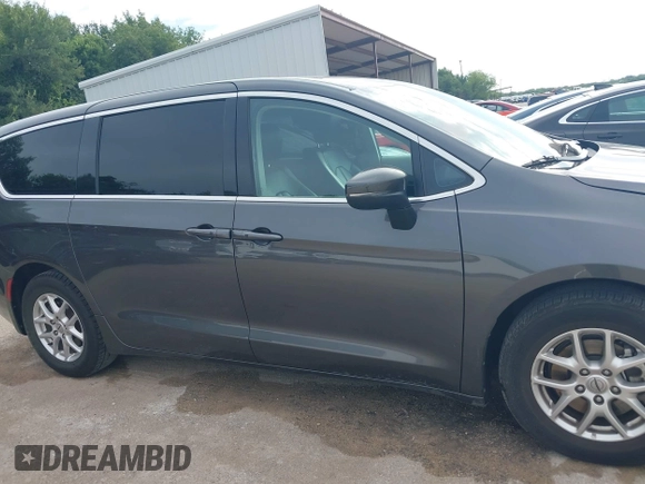 2023 Chrysler Pacifica Touring L with VIN 2C4RC1BG8PR594481, listed as a IAAI auction lot 42618839 with 60,748 mi miles and . Bid and sale history available at DreamBid. Image 13.