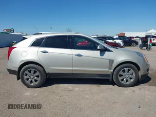 2015 Cadillac SRX Luxury Collection z VIN 3GYFNBE38FS641807, wystawiony jako IAAI lot #41669512 z przebiegiem 147 889 mil mil oraz . Historia ofert i sprzedaży dostępna na DreamBid. Obrazek 13.