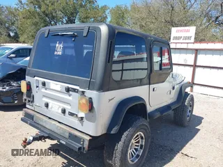1994 Jeep Wrangler S with VIN 1J4FY19P9RP438376, listed as a IAAI auction lot 41751057 with 165,407 mi miles. Bid and sale history available at carsss.com. Image 4.
