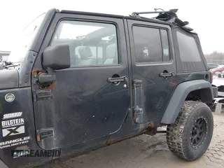 2008 Jeep Wrangler Unlimited X with VIN 1J4GA39138L641138, listed as a IAAI auction lot 41986230 with 215,026 mi miles. Bid and sale history available at carsss.com. Image 15.