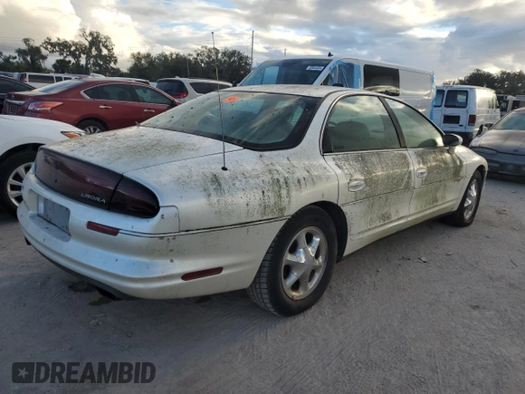 1999 Oldsmobile Aurora with VIN 1G3GR62C2X4107973, listed as a Copart auction lot 84023124 with 80,402 mi miles and Non Repairable. Bid and sale history available at DreamBid. Image 3.