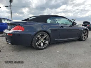 2009 BMW 6 Series M6 z VIN WBSEK93599CY80065, wystawiony jako Copart lot #55277505 z przebiegiem 125 557 mil mil oraz Tytuł czysty. Historia ofert i sprzedaży dostępna na DreamBid. Obrazek 3.