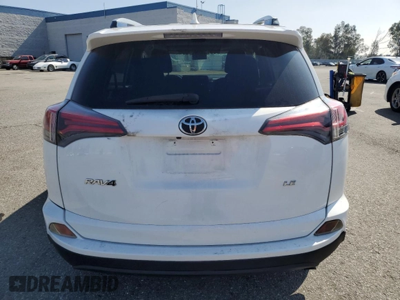 2017 Toyota RAV4 LE with VIN JTMZFREV1HJ104274, listed as a Copart auction lot 55679985 with 105,660 mi miles and Salvage Title. Bid and sale history available at DreamBid. Image 6.