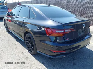 2019 Volkswagen Jetta GLI S z VIN 3VW6T7BU4KM255418, wystawiony jako IAAI lot #42141020 z przebiegiem 74 066 mil mil oraz . Historia ofert i sprzedaży dostępna na DreamBid. Obrazek 3.