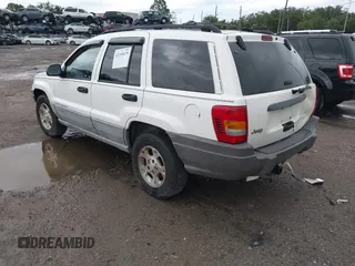 2000 Jeep Grand Cherokee Laredo z VIN 1J4G248S2YC339997, wystawiony jako IAAI lot #42395079 z przebiegiem 261 704 mil mil oraz . Historia ofert i sprzedaży dostępna na DreamBid. Obrazek 3.