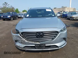 2020 Mazda CX-9 Grand Touring with VIN JM3TCBDY6L0424584, listed as a IAAI auction lot 42473920 with 32,385 mi miles and . Bid and sale history available at DreamBid. Image 12.