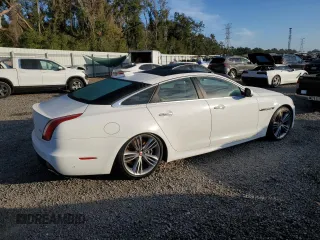 2016 Jaguar XJ with VIN SAJWA1CE4GMV91734, listed as a Copart auction lot 81005144 with 31,924 mi miles and Salvage Title. Bid and sale history available at DreamBid. Image 3.