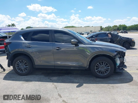 2020 Mazda CX-5 Touring with VIN JM3KFACM9L0826742, listed as a IAAI auction lot 41903755 with 73,409 mi miles and . Bid and sale history available at DreamBid. Image 14.