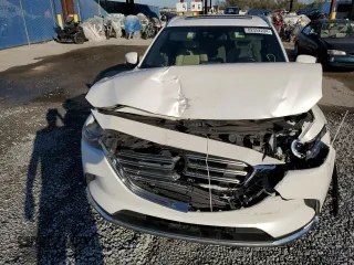 2017 Mazda CX-9 Grand Touring z VIN JM3TCADYXH0127867, wystawiony jako Copart lot #82352204 z przebiegiem 129 349 mil mil oraz Szkoda całkowita • Salvage title. Historia ofert i sprzedaży dostępna na DreamBid. Obrazek 12.
