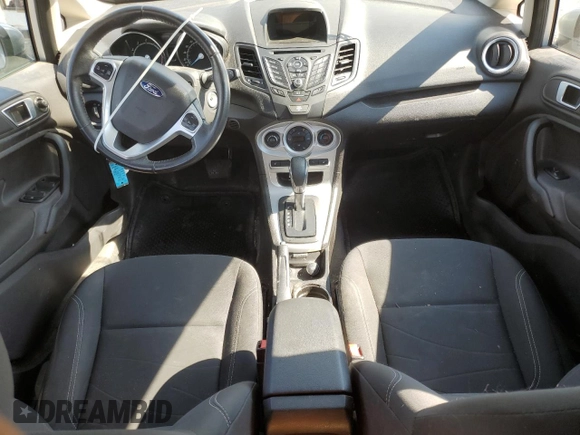 2015 Ford Fiesta SE z VIN 3FADP4EJ0FM212740, wystawiony jako Copart lot #63944573 z przebiegiem 123 037 mil mil oraz Szkoda całkowita • Salvage title. Historia ofert i sprzedaży dostępna na DreamBid. Obrazek 8.