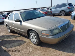 2004 Mercury Grand Marquis GS z VIN 2MEFM74WX4X643435, wystawiony jako IAAI lot #41932119 z przebiegiem 274 468 mil mil oraz . Historia ofert i sprzedaży dostępna na DreamBid. Obrazek 1.