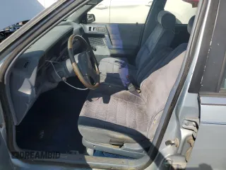 1989 Dodge Spirit z VIN 1B3BA46K1KF408949, wystawiony jako Copart lot #80767594 z przebiegiem 137 766 mil mil oraz Nie do naprawy. Historia ofert i sprzedaży dostępna na DreamBid. Obrazek 7.