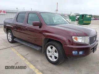 2014 Honda Ridgeline RTL with VIN 5FPYK1F52EB010700, listed as a IAAI auction lot 41490401 with 180,947 mi miles. Bid and sale history available at carsss.com. Image 1.