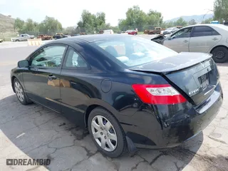 2010 Honda Civic Cpe LX with VIN 2HGFG1B60AH536376, listed as a IAAI auction lot 41905320 with 121,602 mi miles. Bid and sale history available at carsss.com. Image 3.