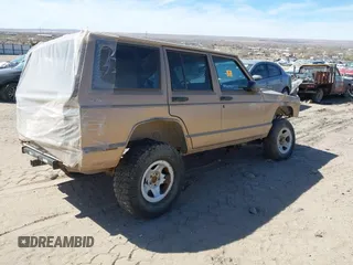 1999 Jeep Cherokee SE with VIN 1J4FF28S5XL520501, listed as a IAAI auction lot 41706800 with Not provided miles and . Bid and sale history available at DreamBid. Image 4.
