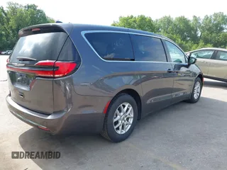2023 Chrysler Pacifica Touring L with VIN 2C4RC1BG6PR612749, listed as a IAAI auction lot 42612932 with 69,931 mi miles and . Bid and sale history available at DreamBid. Image 4.