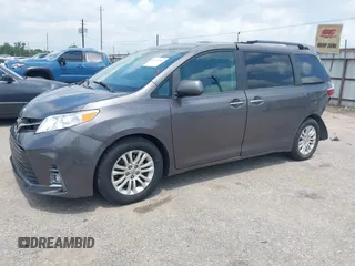 2015 Toyota Sienna XLE with VIN 5TDYK3DCXFS688971, listed as a IAAI auction lot 42127912 with 143,024 mi miles. Bid and sale history available at carsss.com. Image 2.