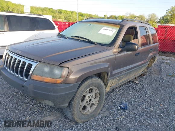 2002 Jeep Grand Cherokee with VIN 1J4GW38N42C202219, listed as a IAAI auction lot 42035162 with 220,012 mi miles and . Bid and sale history available at DreamBid. Image 2.