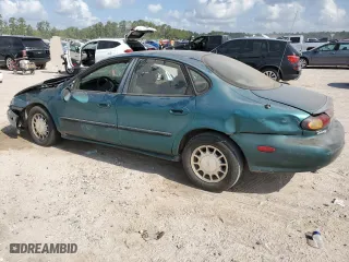 1997 Ford Taurus LX with VIN 1FALP53S1VG316689, listed as a Copart auction lot 67168694 with 211,414 mi miles and Salvage Title. Bid and sale history available at carsss.com. Image 2.