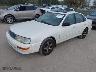 1997 Toyota Avalon XL with VIN 4T1BF12B1VU144017, listed as a IAAI auction lot 41602761 with 163,955 mi miles. Bid and sale history available at carsss.com. Image 2.