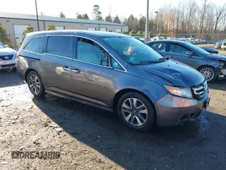2014 Honda Odyssey Touring with VIN 5FNRL5H94EB081267, listed as a IAAI auction lot 41199509 with 146,827 mi miles and . Bid and sale history available at DreamBid. Image 1.