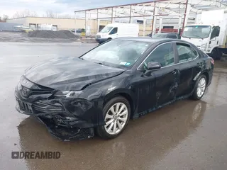 2019 Toyota Camry LE with VIN 4T1B11HK2KU263910, listed as a IAAI auction lot 42060008 with 31,433 mi miles and . Bid and sale history available at DreamBid. Image 2.