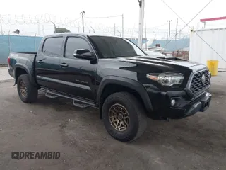 2023 Toyota Tacoma 4WD SR with VIN 3TMCZ5AN5PM533379, listed as a IAAI auction lot 42052154 with 31,776 mi miles. Bid and sale history available at carsss.com. Image 1.