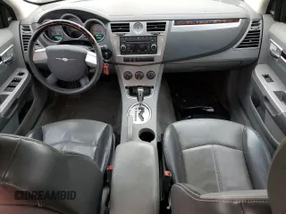2008 Chrysler Sebring Limited z VIN 1C3LC66KX8N295515, wystawiony jako Copart lot #57480675 z przebiegiem 149 569 mil mil oraz Szkoda całkowita • Salvage title. Historia ofert i sprzedaży dostępna na DreamBid. Obrazek 8.