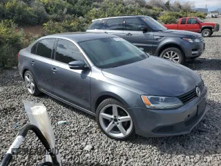 2012 Volkswagen Jetta SE with VIN 3VWDP7AJ2CM311442, listed as a Copart auction lot 55118825 with 124,478 mi miles and Salvage title. Bid and sale history available at DreamBid. Image 4.