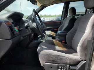 1999 Jeep Grand Cherokee Limited with VIN 1J4GW68N4XC663476, listed as a Copart auction lot 52449925 with 174,583 mi miles and Salvage Title. Bid and sale history available at carsss.com. Image 7.