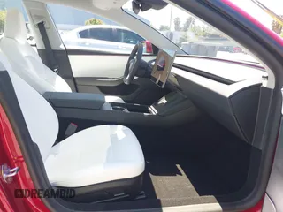 2025 Tesla Model 3 Long Range with VIN 5YJ3E1EA6SF917745, listed as a IAAI auction lot 42533673 with 7,305 mi miles and . Bid and sale history available at DreamBid. Image 5.