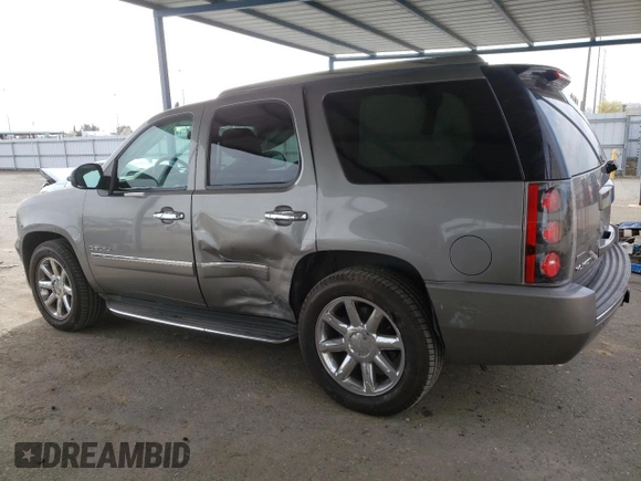 2012 GMC Yukon Denali with VIN 1GKS1EEFXCR236823, listed as a Copart auction lot 49830405 with 134,568 mi miles and Salvage Title. Bid and sale history available at carsss.com. Image 2.