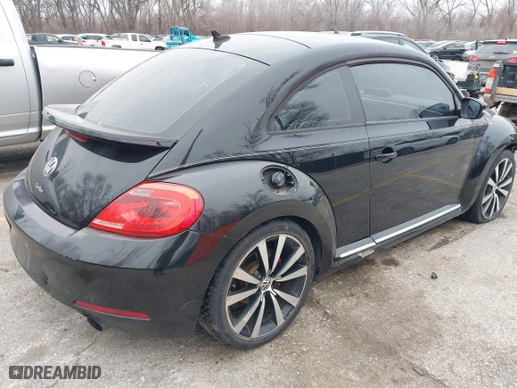 2012 Volkswagen Beetle 2.0T Turbo PZEV with VIN 3VWVA7AT1CM635697, listed as a IAAI auction lot 41552112 with 150,689 mi miles. Bid and sale history available at carsss.com. Image 3.