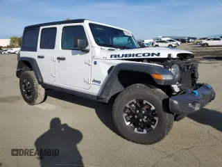 2024 Jeep Wrangler Rubicon with VIN 1C4RJXR6XRW115879, listed as a Copart auction lot 45816825 with 34,557 mi miles and Salvage Title. Bid and sale history available at DreamBid. Image 4.