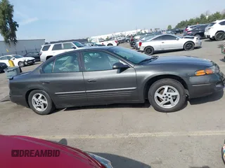 2003 Pontiac Bonneville SE z VIN 1G2HX52K934181238, wystawiony jako IAAI lot #41483636 z przebiegiem 176 737 mil mil oraz . Historia ofert i sprzedaży dostępna na DreamBid. Obrazek 13.