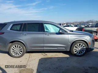 2020 Cadillac XT6 FWD Premium Luxury z VIN 1GYKPCRS8LZ129799, wystawiony jako IAAI lot #41602536 z przebiegiem 96 865 mil mil oraz . Historia ofert i sprzedaży dostępna na DreamBid. Obrazek 13.