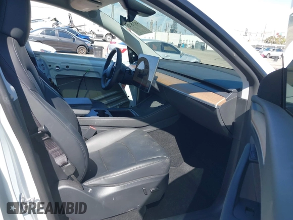2023 Tesla Model Y Long Range with VIN 7SAYGDEEXPA129790, listed as a IAAI auction lot 41735721 with 20,402 mi miles and . Bid and sale history available at DreamBid. Image 5.