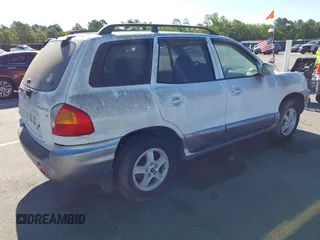 2003 Hyundai Santa Fe GLS z VIN KM8SC13D33U463702, wystawiony jako IAAI lot #42302300 z przebiegiem 226 340 mil mil oraz . Historia ofert i sprzedaży dostępna na DreamBid. Obrazek 4.