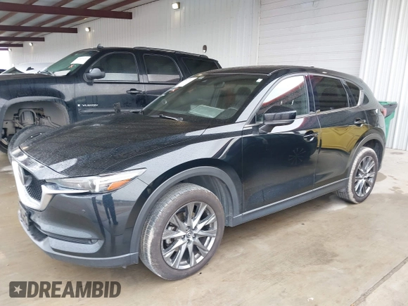2021 Mazda CX-5 Signature with VIN JM3KFBEY5M0432033, listed as a IAAI auction lot 41607215 with 49,870 mi miles. Bid and sale history available at carsss.com. Image 2.